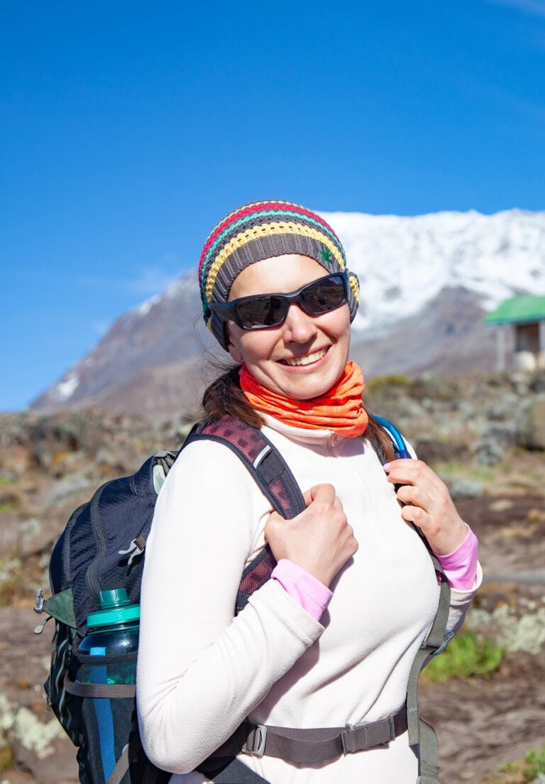Female backpacker on the trek to Kilimanjaro mountain
